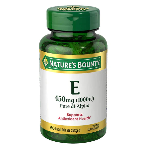 A bottle of Nature's Bounty Vitamin E 450mg softgels with 60 rapid release softgels. The label indicates it supports immune and antioxidant health.