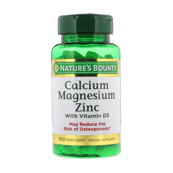 A bottle of Nature's Bounty Calcium Magnesium Zinc with Vitamin D3 supplements containing 100 tablets.