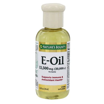 A bottle of Nature's Bounty Vitamin E Oil, 30,000 IU with a white label, green and orange branding, and a white cap.